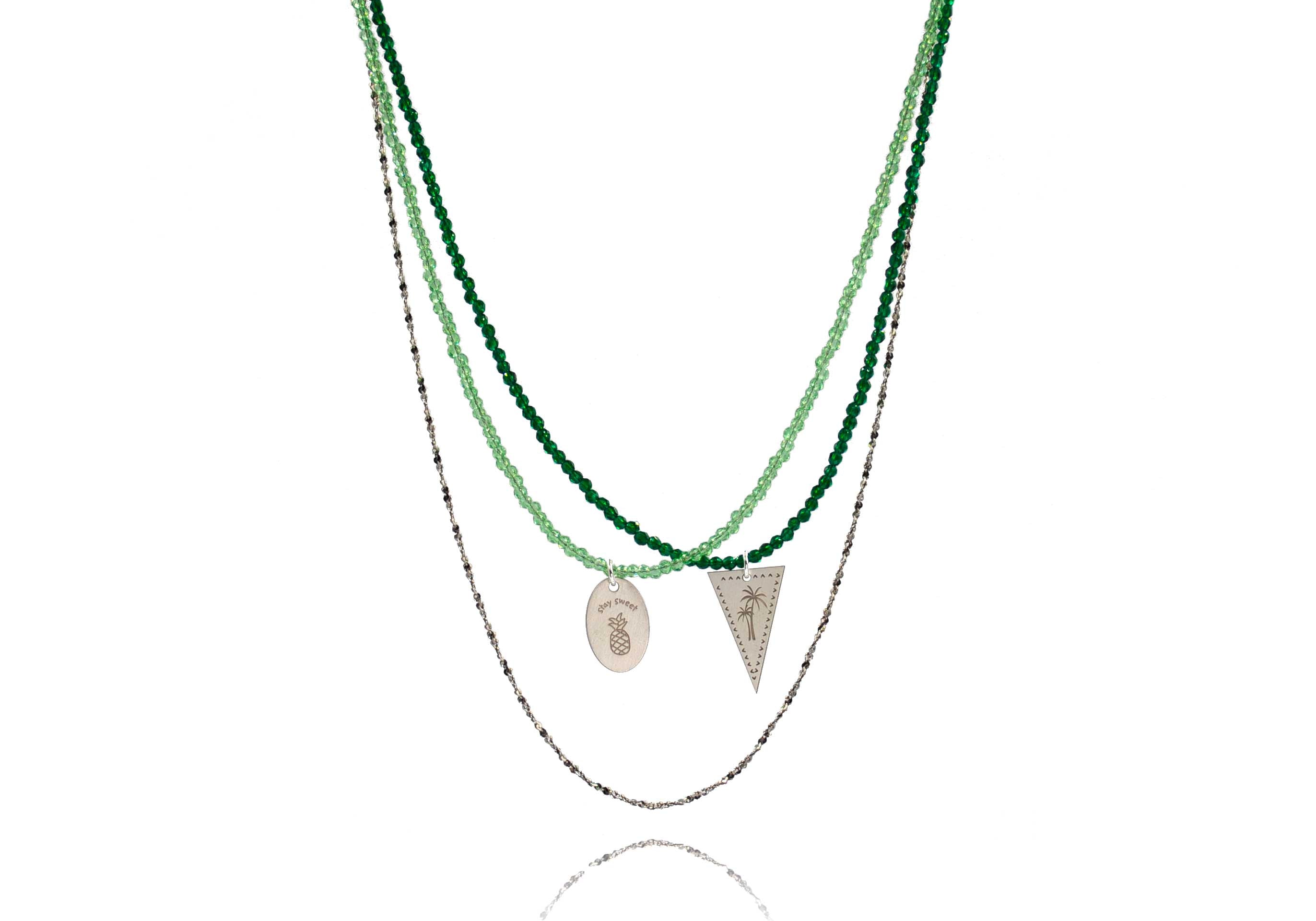 A combo of 3 different necklaces in green tones with crystals, semiprecious stones, silver 925 chain, combined with silver 925 charms in various shapes and with different desings - palm tree, pineapple  - and messages like ´´stay sweet´´.