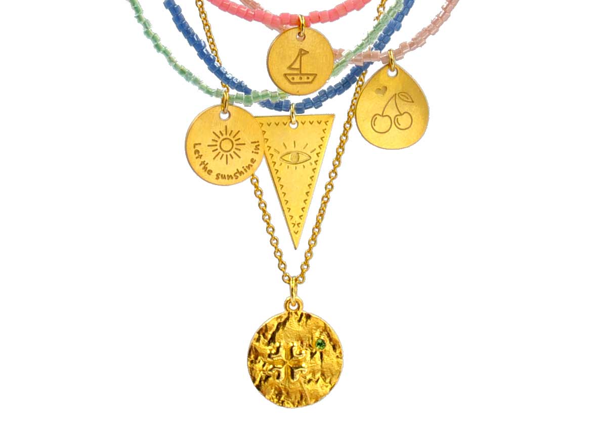 A combo of 5 different necklaces with japanese miyuki beads, silver 925 gold plated chain combined with silver 925 gold plated charms in various shapes with different designs - boat, cherries, eye, clover - and messages like ´´let the sunshine in!´´
