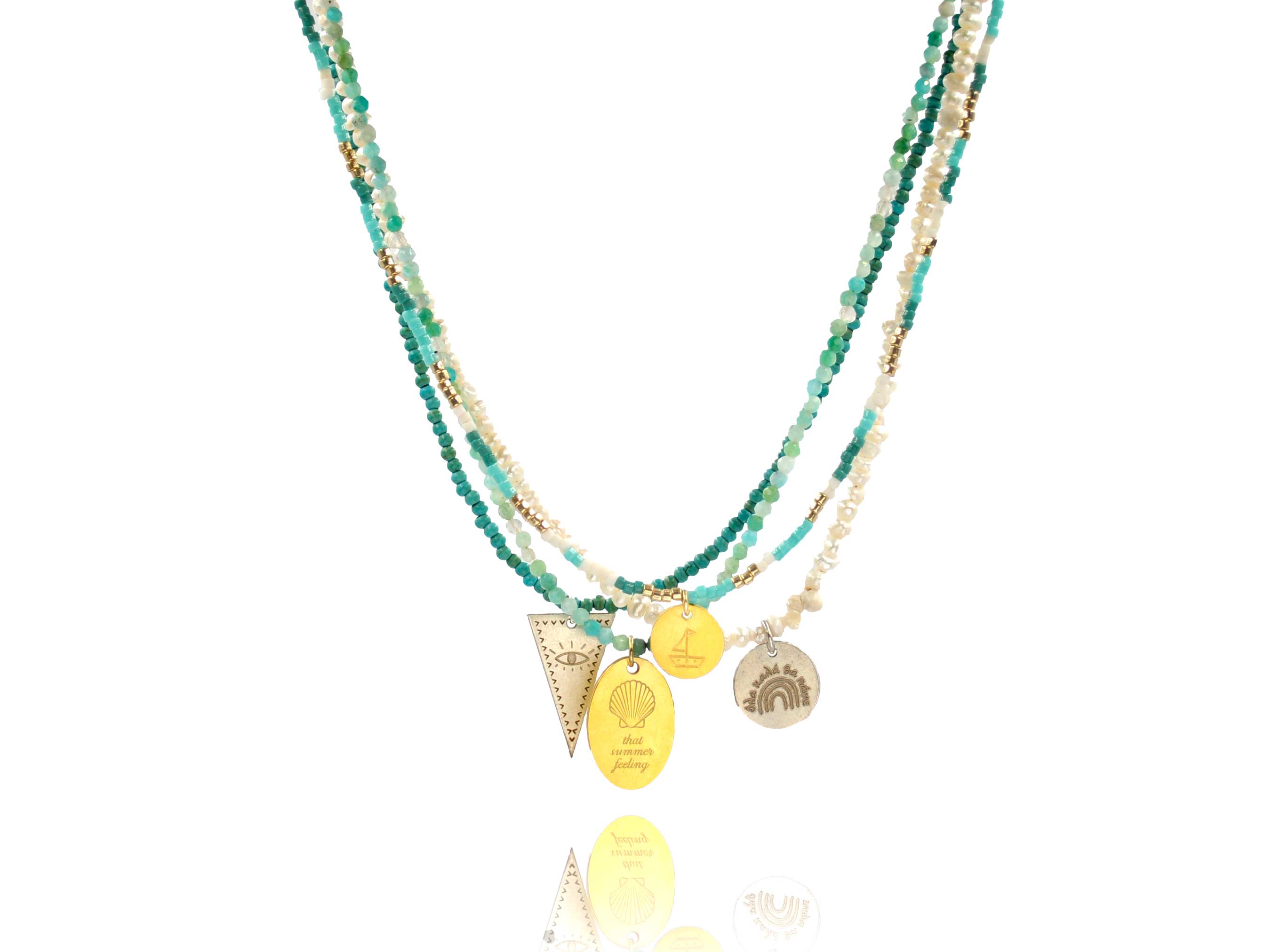 A combo of 4 different necklaces made of gemstones, japanese miyuki beads, crystal and white pearls combined with silver 925 charms with different designs - eye, boat -. and messages like ´´ that summer feeling´´ and ´´όλα καλά θα πάνε''.
