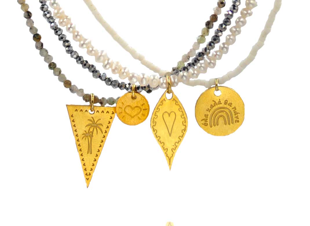 A combo of 4 different necklaces with semiprecious gemstones, white pearls and silver 925 gold plated charms with beautiful designs - palm tree, little heart, long heart - and message as ''ολα καλα θα πανε''.