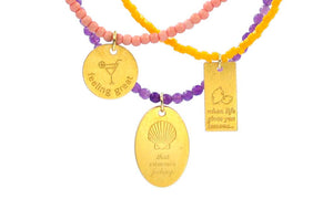 Silver 925 gold plated charms from 3 necklaces made with semiprecious stones and miyuki beads. Messages like ''feeling great'', ''that summer feeling'' and ''when life gives you lemons''.