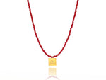 Load image into Gallery viewer, A necklace made of red fire crystal beads and a squared silver 925 charm plated in gold 24K, with a messages like ´´όλα λάθος&#39;&#39; -&#39;It&#39;s all wrong! .
