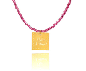 A necklace made of fucshia japanese miyuki beads and a squared silver 925 charm plated in gold 24K, with a message ´´όλα λάθος'' -'It's all wrong! .
