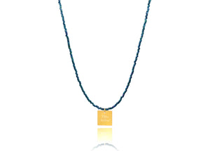 A necklace made of blue japanese miyuki beads and a squared silver 925 charm plated in gold 24K, with a message ´´όλα λάθος'' -'It's all wrong! .