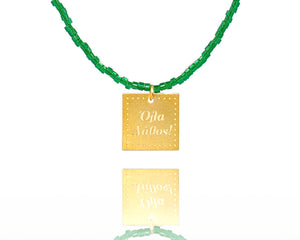 A necklace made of forest green japanese miyuki beads and a squared silver 925 charm plated in gold 24K, with a message ´´όλα λάθος'' -'It's all wrong! .